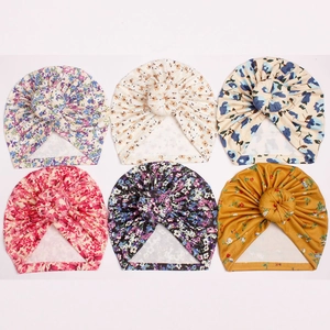 Set of six floral ribbed baby turban hats with donut knots in various colorful prints