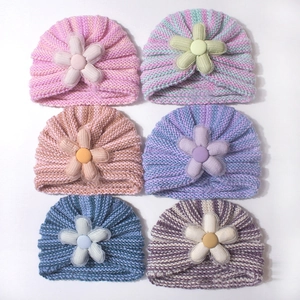 Set of six baby knit beanies with decorative flowers in assorted pastel color stripes