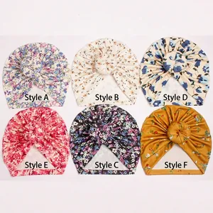 Detail showing six floral pattern options for newborn donut headwraps with knotted design