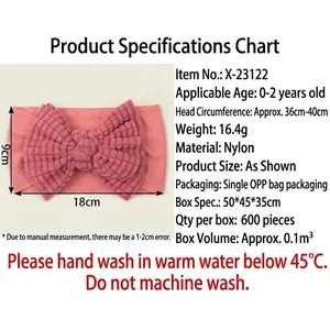 Soft pink nylon headband for babies featuring a large waffle-textured bow for infants