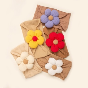 Detailed close-up of 5pcs baby coffee turban set featuring colorful knit 3D flower headbands