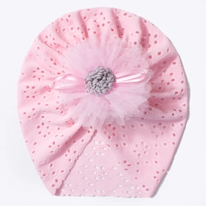 Pink breathable hollow lace baby bonnet featuring a large decorative mesh flower and bow