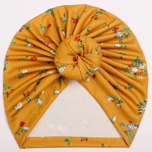Infant ribbed ginger yellow donut hat with floral print and central knot decoration
