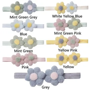 Détail de neuf bandeaux pour bébé avec fleurs en peluche colorées et bandes élastiques