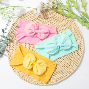 Trois bandeaux en nylon doux pour bébé avec de grands nœuds en mousseline colorés