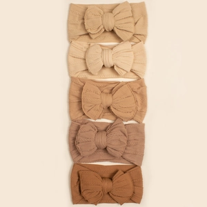 Lot de 5 bandeaux bébé tons terre avec grands nœuds et texture en tricot