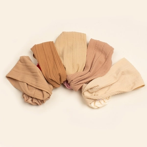 Set of 5 elastic knit baby headbands in neutral earth tones with twisted knot details