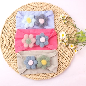 Three-piece set of elastic nylon baby headbands with soft fabric floral decorations