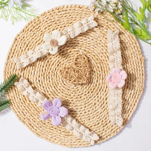 Three-piece baby lace headbands with soft fabric flowers in cream, purple, and pink hues