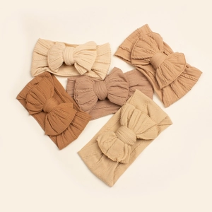 Lot de 5 bandeaux bébé avec grands nœuds aux tons terre et texture en maille