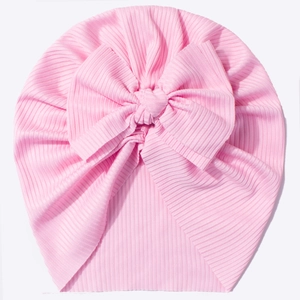 Pink ribbed newborn beanie with large decorative bow for baby girls, soft breathable cotton