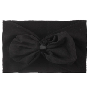 Détail d'un bandeau en nylon noir souple avec un grand nœud décoratif en mousseline pour bébé
