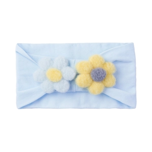 Close-up of baby nylon headband with 3D handmade crochet flowers in soft light blue