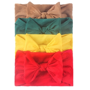 Set of 4 soft stretchy nylon baby headbands with large bows in red, yellow, green, brown