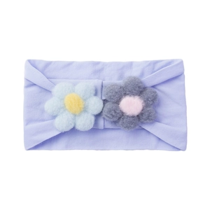 Detail of soft lilac nylon baby headband with 3D knitted flowers in pastel colors