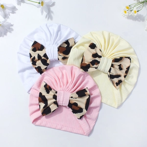 3-pack infant beanie hats in pink, white, and yellow with stylish leopard print bows