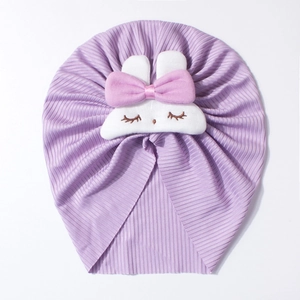 Close-up of purple ribbed baby beanie with a cute white rabbit patch and pink bow detail