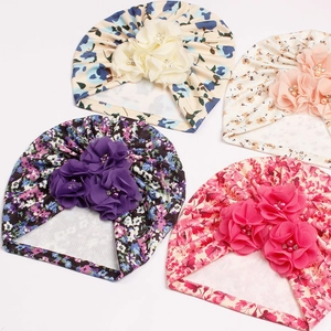 Floral ribbed baby turban hats with large flower knots and pearl accents in multiple colors