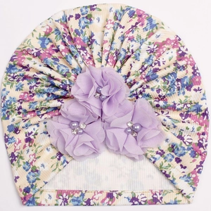 Detail of floral baby turban hat featuring ribbed cotton fabric and chiffon flower accents