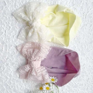 Soft lace bow baby headbands in pastel yellow and purple with floral embroidery
