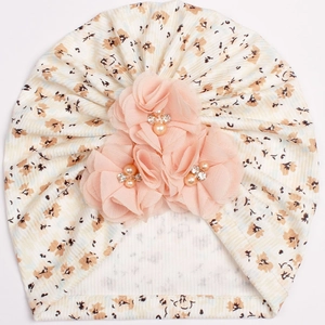 Detailed macro of floral baby turban with rib fabric and 3D chiffon flowers with pearls