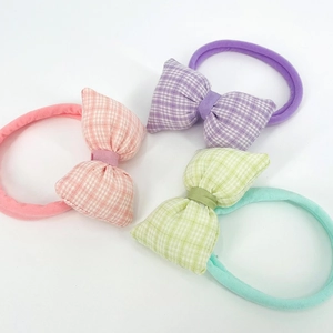 Set of four colorful gingham bow nylon headbands for babies in soft pastel shades