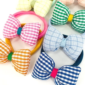 Set of colorful gingham checkered bow hair ties on seamless nylon elastics for toddlers