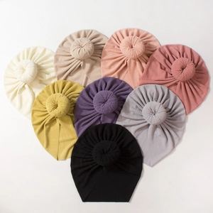 Soft ribbed knit donut turban hats for infants and toddlers in eight assorted colors