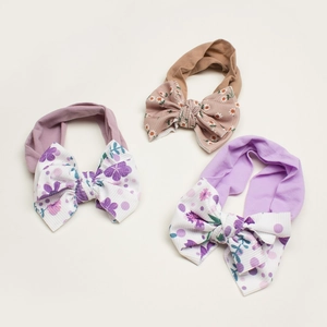 Set of three printed nylon baby headbands with large bows in soft pastel floral patterns