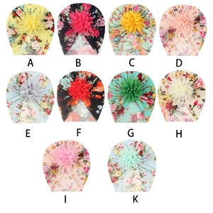 Detailed grid of ten floral print baby turbans with 3D fabric flowers in various patterns