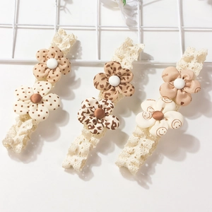 Three-piece set of cute floral baby headbands featuring lace straps and smile flower designs