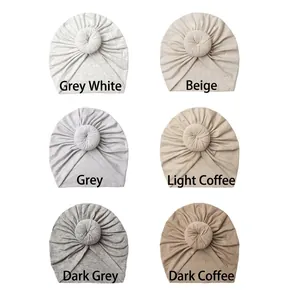 Detailed grid view of soft donut baby hats in six assorted Morandi color tones