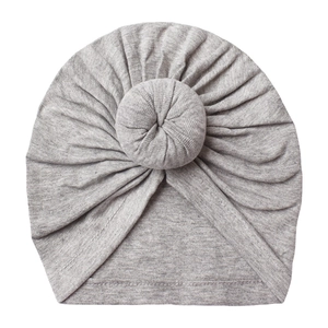 Detail of grey baby turban hat showing donut knot and soft ribbed knit texture