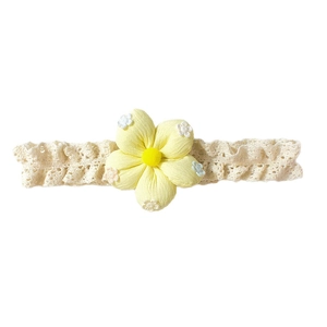 Bandeau bébé en dentelle respirante orné d'une fleur jaune en tissu avec pompon doux