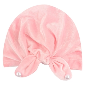 Pink velvet baby knot hat featuring soft fabric and elegant pearl embellishments