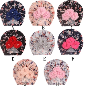 Sélection de turbans pour bébés avec fleurs en tissu et perles artificielles au centre