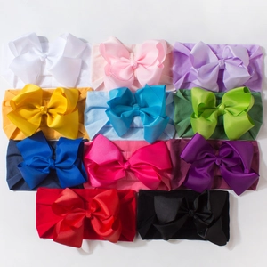 Set of 11 vibrant stretch baby headbands with large grosgrain ribbon bows for infants
