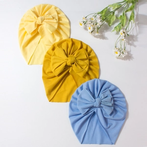 Soft cotton baby turban hats with large bows in yellow, ginger and blue colors