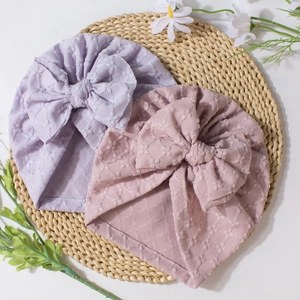 Soft striped baby turban hats with large bows in purple and pink textured knit fabric