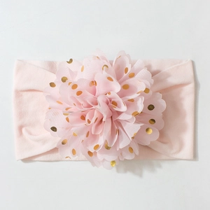 Bandeau bébé rose avec grande fleur en mousseline à pois dorés sur tissu élastique