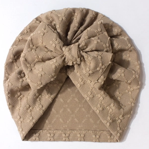 Soft baby turban hat with oversized bow in khaki knitted fabric for infants