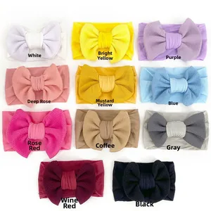 Close-up of baby waffle headbands showing eleven vibrant colors and soft knitted texture