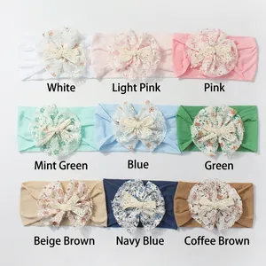 Detail of nine-piece baby nylon headband set with delicate lace flowers and bows