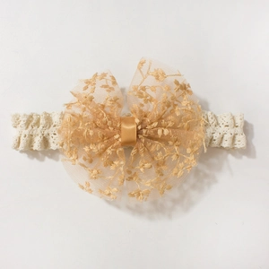 Off-white lace baby headband with golden brown embroidery mesh bow for children