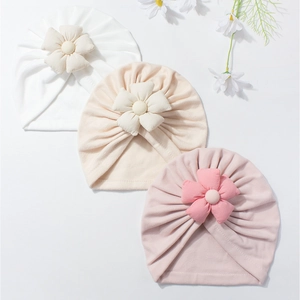 Soft cotton baby turban hats with large 3D flowers for newborns and infants in pastel colors