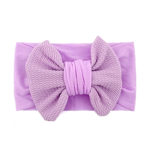 Soft lavender baby bow headband with textured knitted fabric for infant photography
