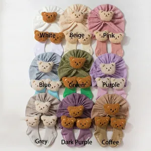 Flat lay of baby hat and sock sets with cute bear ears in nine vibrant colors