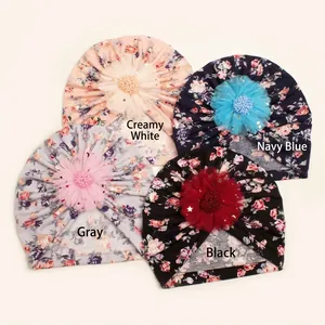 Set of four soft cotton baby turbans with floral patterns and large mesh flower accents