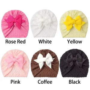 Detail showing six colors of breathable bubble fabric baby turban hats with large bows