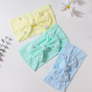 Set di tre fasce per neonati con fiocchi di perle in giallo, menta e azzurro chiaro